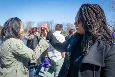 Ayanna Pressley high fives a person at the Walk for Change