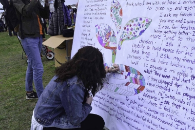 Participant at 2019 Walk for Change coloring in I Ask sprout mandala