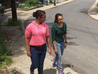 Two members of BARCC Youth Leadership Corps YLC walking 