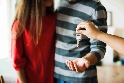Keys being handed to a couple