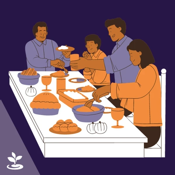 Una familia de cuatro personas disfruta de una comida juntos en una mesa con varios platos, incluido un pastel y una calabaza.